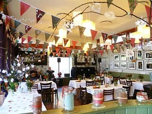The Garden Café room with bunting in an earlier visitor photo